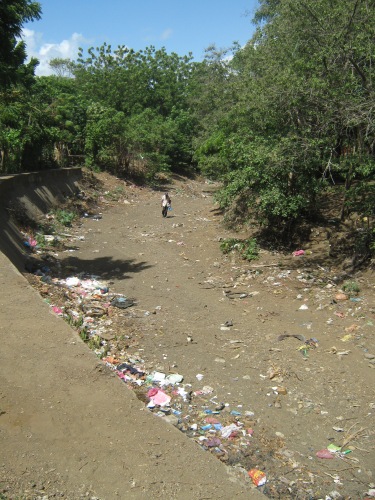 This ditch runs parallel to my school. The community dumps and burns trash here due to lack of sanitation services. When the rains come, it sweeps the trash down to Lake Man
